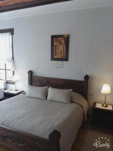 Postel nebo postele na pokoji v ubytování Hotel Gjirokastra
