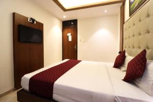 Postel nebo postele na pokoji v ubytování GATEWAY STAR HOTEL