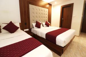Postel nebo postele na pokoji v ubytování GATEWAY STAR HOTEL