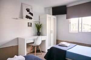Postel nebo postele na pokoji v ubytování V Pension & Suites