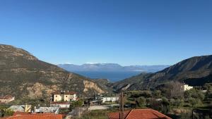 a view of the ocean from a mountain at Guesthouse Charitou in Áno Dhiakoptón