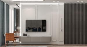 a living room with a tv on a white wall at Luminoso Boutique Hotel in Budva +34 photos