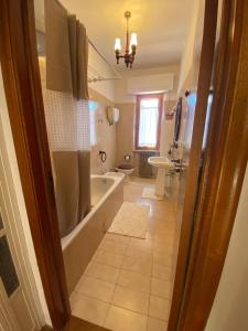 a bathroom with a tub and a sink at Pasquina and the Val d'Orcia in Vivo dʼOrcia +33 photos