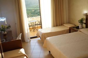 Postel nebo postele na pokoji v ubytování Grand Hotel Sofia