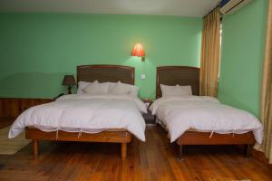 Tempat tidur dalam kamar di Hotel Ganesh Himal