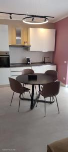 a kitchen with a table and chairs in a room at La Panoramica in Varazze