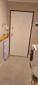 a large white door in a room at La Panoramica in Varazze