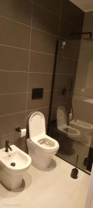 a bathroom with a toilet and a sink at La Panoramica in Varazze