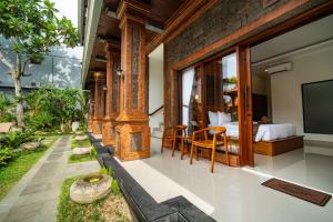 a bedroom in a villa with a bed at Pendopo Canggu Village in Canggu