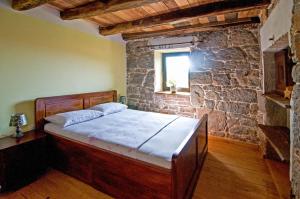 Postel nebo postele na pokoji v ubytování Casa Storia & Casa Antica