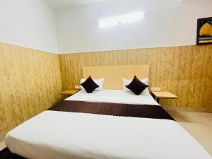 Postel nebo postele na pokoji v ubytování Hotel Vasundhara Grand - Vasundhara