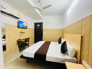 Postel nebo postele na pokoji v ubytování Hotel Vasundhara Grand - Vasundhara