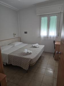 Postel nebo postele na pokoji v ubytování Hotel Gioiella
