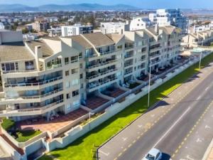 an aerial view of a building in a city at Cape Town Beachfront Accommodation in Blouberg in Bloubergstrand