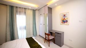 Postel nebo postele na pokoji v ubytování Rose Apartment in Najjera