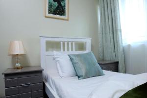 Postel nebo postele na pokoji v ubytování Rose Apartment in Najjera