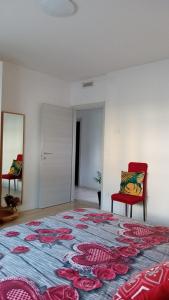 En eller flere senge i et værelse på Appartment Lodged Mamma Maria