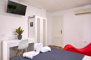 Postel nebo postele na pokoji v ubytování V Pension & Suites