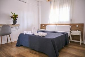 Postel nebo postele na pokoji v ubytování V Pension & Suites