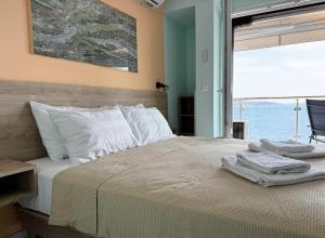 Postel nebo postele na pokoji v ubytování Agapaki Studios