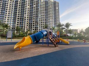 a playground in front of a large building at Central Park Premium 4pax unit in Johor Bahru