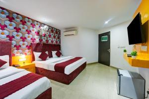 Postel nebo postele na pokoji v ubytování Hotel Happy Stay Delhi Airport
