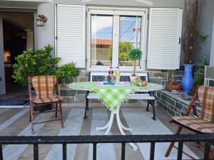 a patio with a table and two chairs at Efi's Studio - Marathon in Marathón