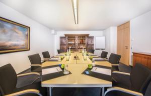 a conference room with a long table and chairs at Collegium Leoninum in Bonn