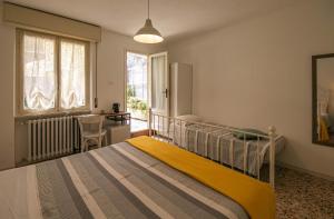 Postel nebo postele na pokoji v ubytování InGarda Rooms