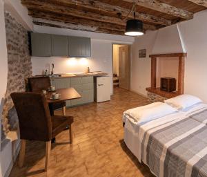 Postel nebo postele na pokoji v ubytování InGarda Rooms