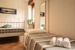 Postel nebo postele na pokoji v ubytování InGarda Rooms
