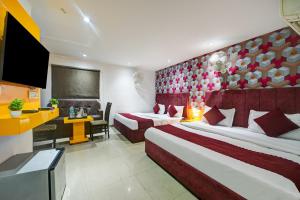Postel nebo postele na pokoji v ubytování Hotel Happy Stay Delhi Airport