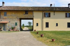 an entrance to an old building with a doorway at Agriturismo Cascina Mora in Pavia
