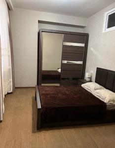 Ένα ή περισσότερα κρεβάτια σε δωμάτιο στο City Center Comfortable Room