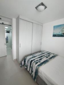 Ένα ή περισσότερα κρεβάτια σε δωμάτιο στο Sol y Brisa 811