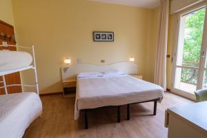Postel nebo postele na pokoji v ubytování Only Room Hotel