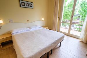 Postel nebo postele na pokoji v ubytování Only Room Hotel