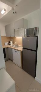 Η κουζίνα ή μικρή κουζίνα στο Maison avec 2 chambres dans une résidence privée +4 φωτογραφίες