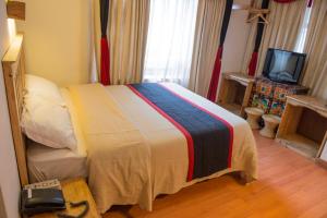 Tempat tidur dalam kamar di Hotel Ganesh Himal
