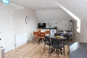 a kitchen and dining room with a table and chairs at Diamond House in Ardara