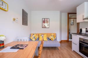 a living room with a couch and a table at Galway - 1 Bed Guest Flat in Galway