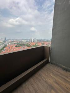 a balcony with a view of a city at Lumi Tropicana - Idealhub in Petaling Jaya