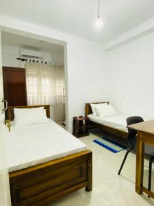 Ένα ή περισσότερα κρεβάτια σε δωμάτιο στο Pearl House