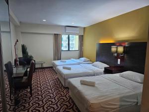 A bed or beds in a room at Kota Kinabalu City Ensuite at SCSP Ming Garden