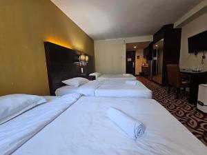 A bed or beds in a room at Kota Kinabalu City Ensuite at SCSP Ming Garden