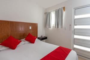 Postel nebo postele na pokoji v ubytování Capital O Hotel Emperadores Inn, Atlixco