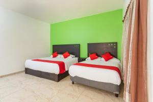 Postel nebo postele na pokoji v ubytování Capital O Hotel Emperadores Inn, Atlixco
