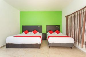 Postel nebo postele na pokoji v ubytování Capital O Hotel Emperadores Inn, Atlixco