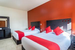 Postel nebo postele na pokoji v ubytování Capital O Hotel Emperadores Inn, Atlixco