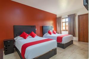 Postel nebo postele na pokoji v ubytování Capital O Hotel Emperadores Inn, Atlixco